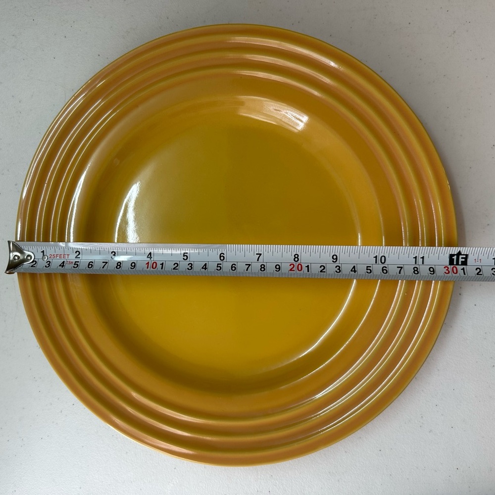 Le creuset 12 inch dinner plate in yellow